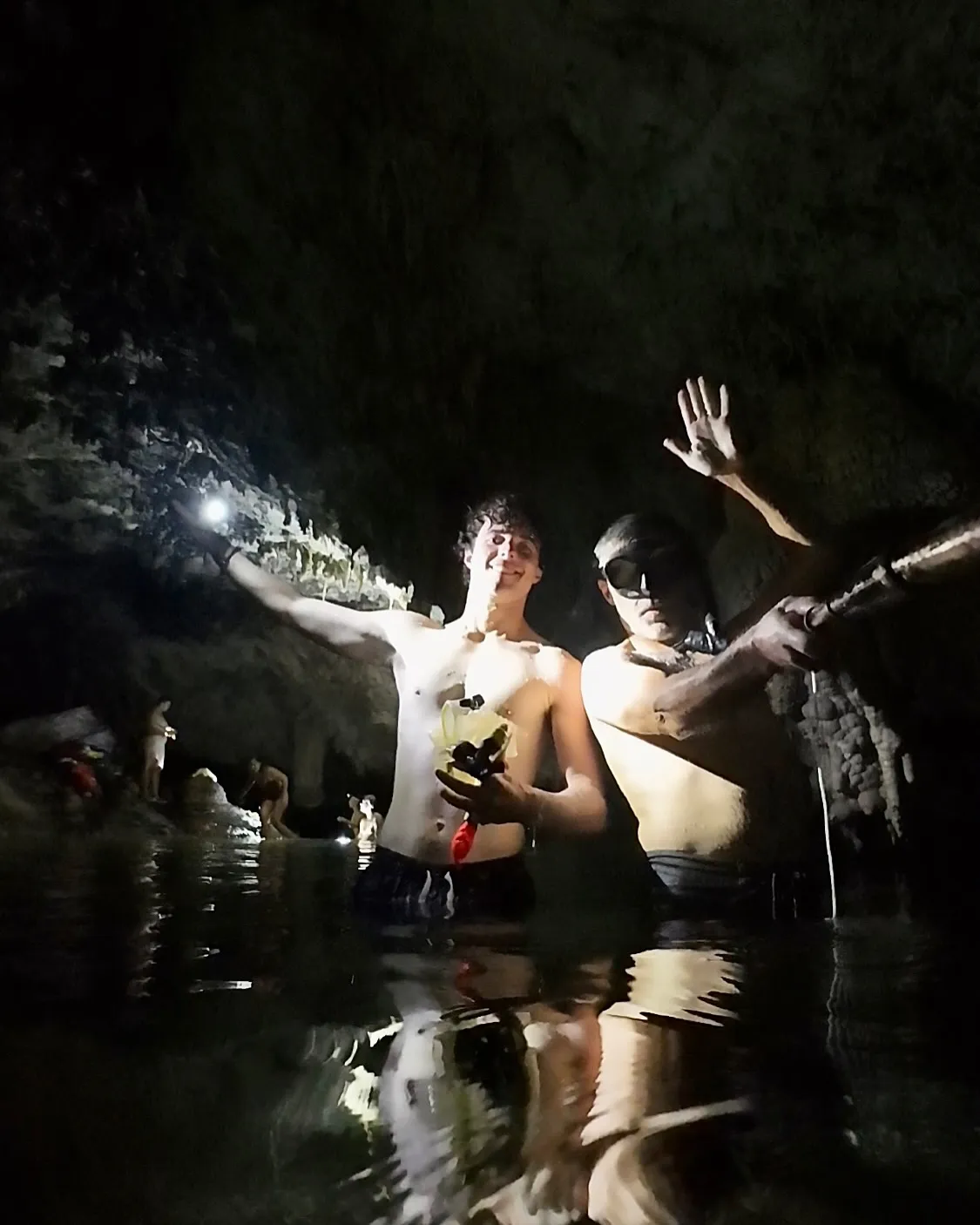 Torchlit fun in the cave pool. Torchlit fun in the cave pool.