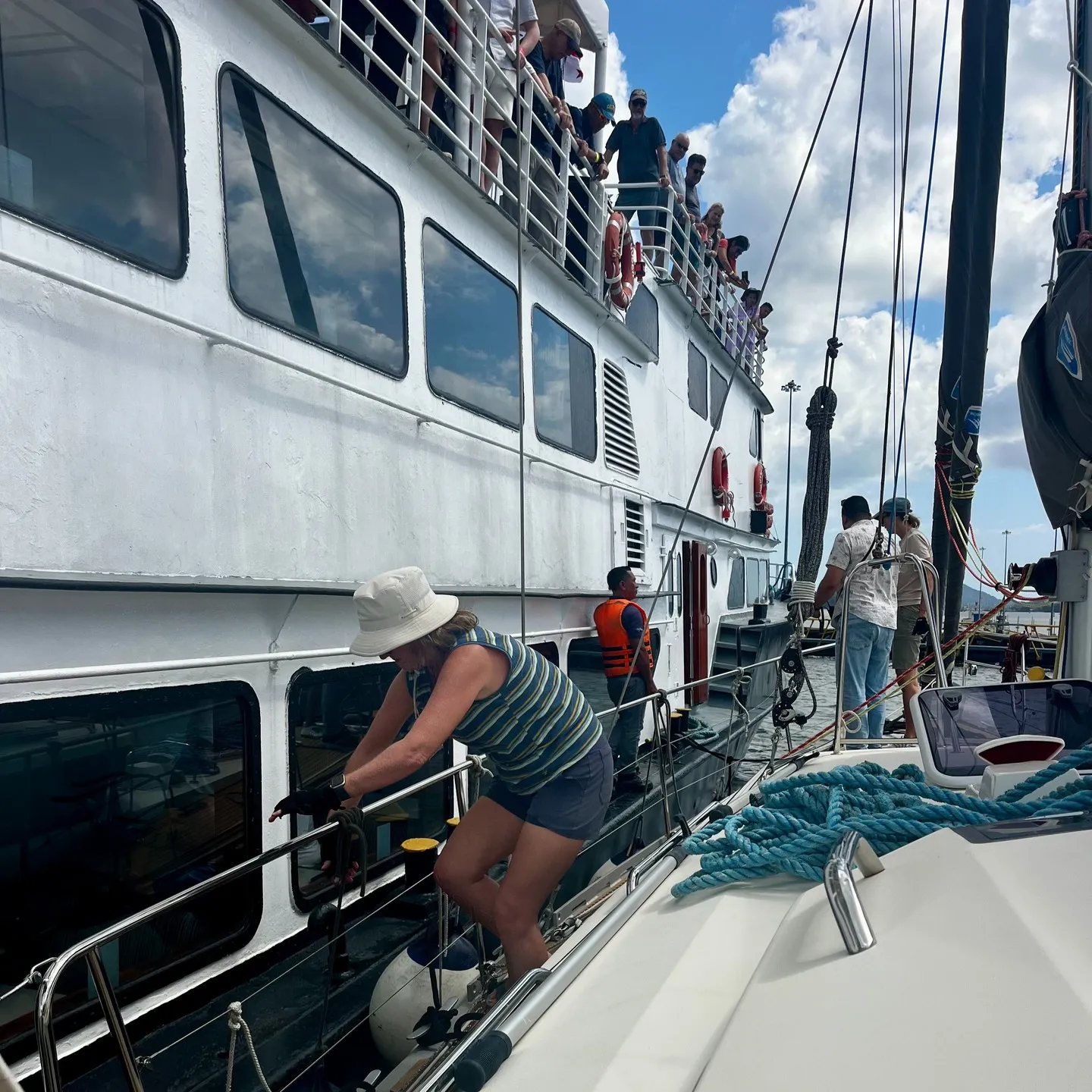 Tying on to a tourist ship, with an audience. Tying on to a tourist ship, with an audience.