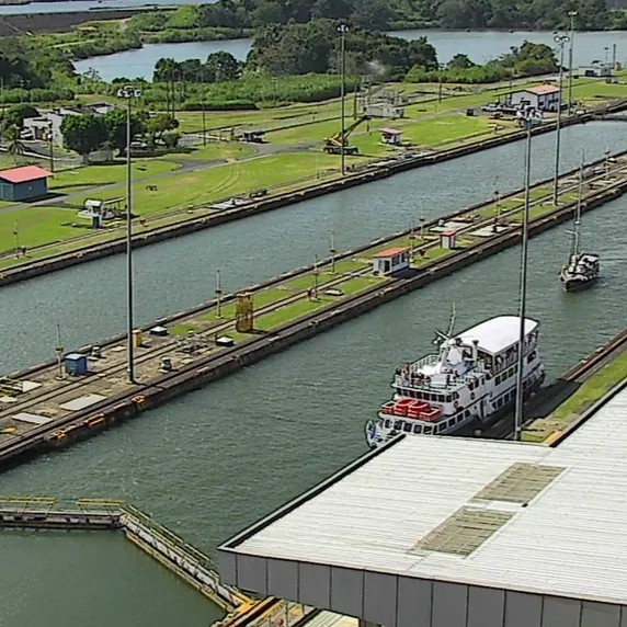 A tourist boat and a sailboat sharing the locks. A tourist boat and a sailboat sharing the locks.