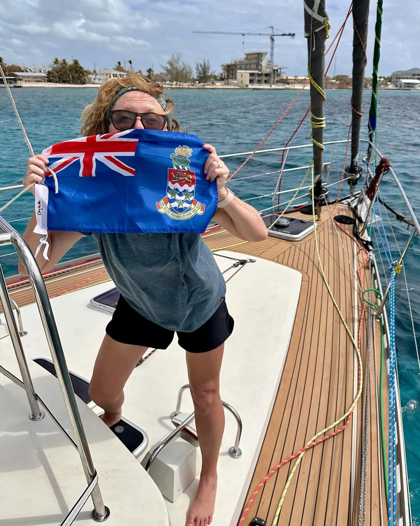 Raising the Cayman Islands courtesy flag.