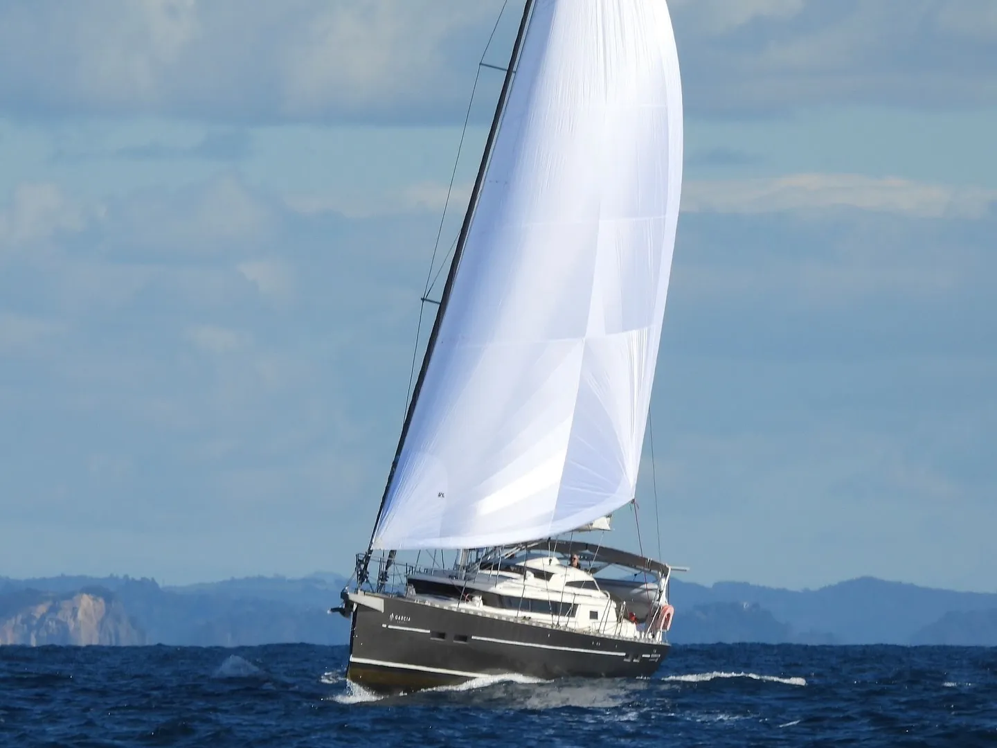 Our new code zero sail on display as we leave the Bay of Islands. Our new code zero sail on display as we leave the Bay of Islands.