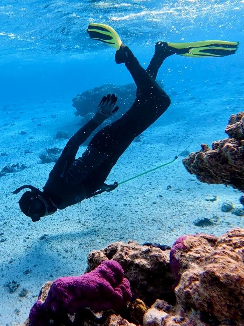 Freediving down to the coral. Freediving down to the coral.