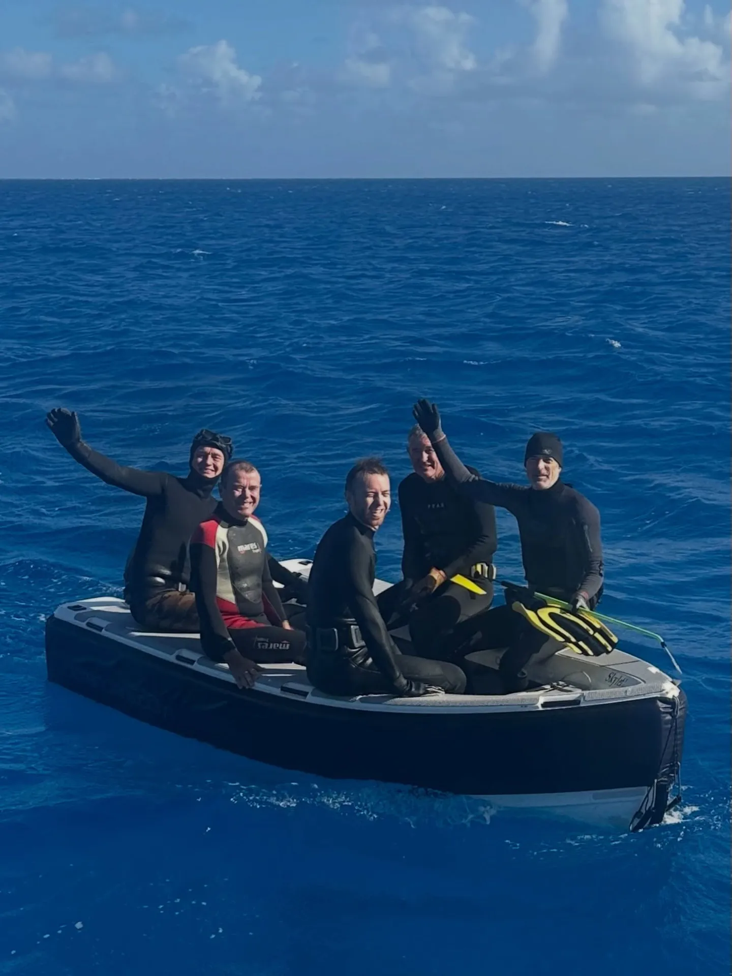 A dinghy full of happy divers. A dinghy full of happy divers.