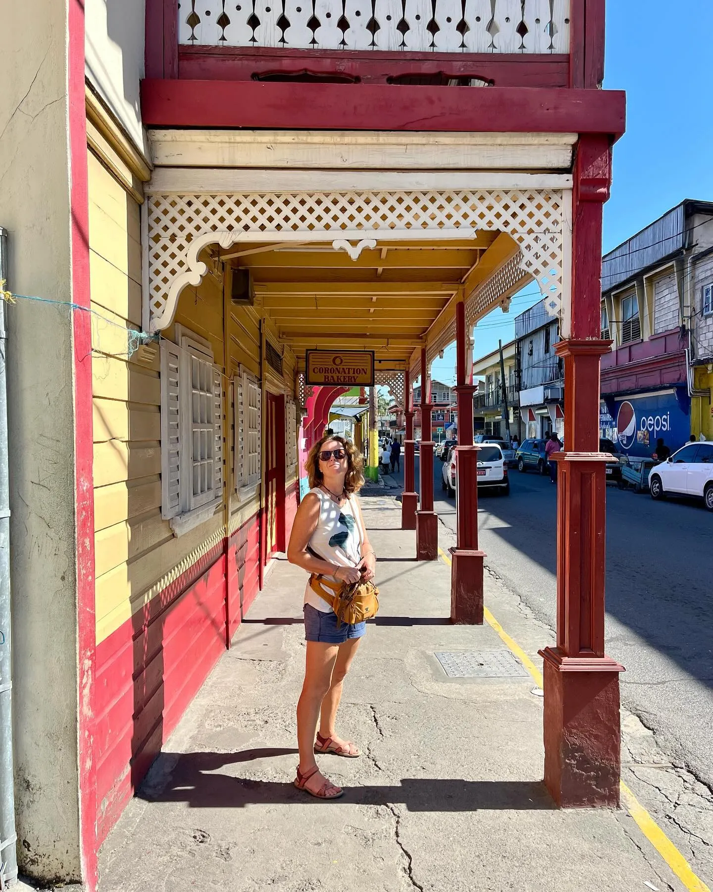 Shady verandas and bright paintwork in town.