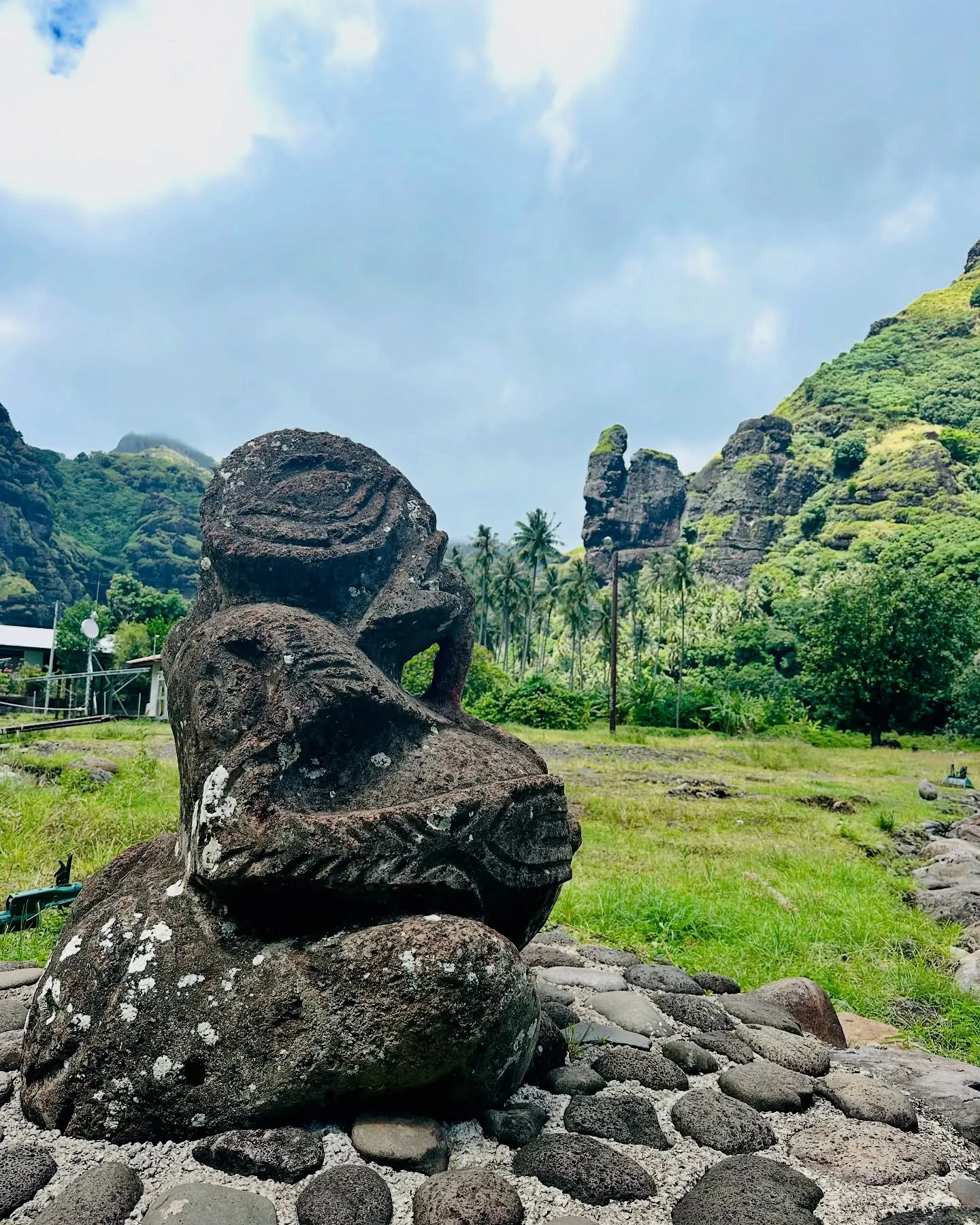 An ancient stone tiki beneath the peaks. An ancient stone tiki beneath the peaks.