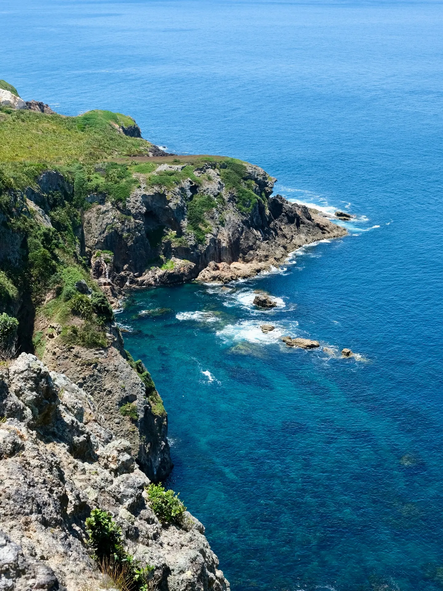 Clear blue water below the cliffs. Clear blue water below the cliffs.