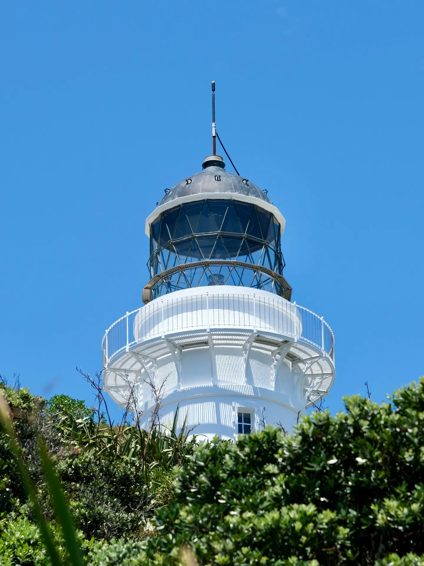 The lighthouse against a perfect blue sky. The lighthouse against a perfect blue sky.
