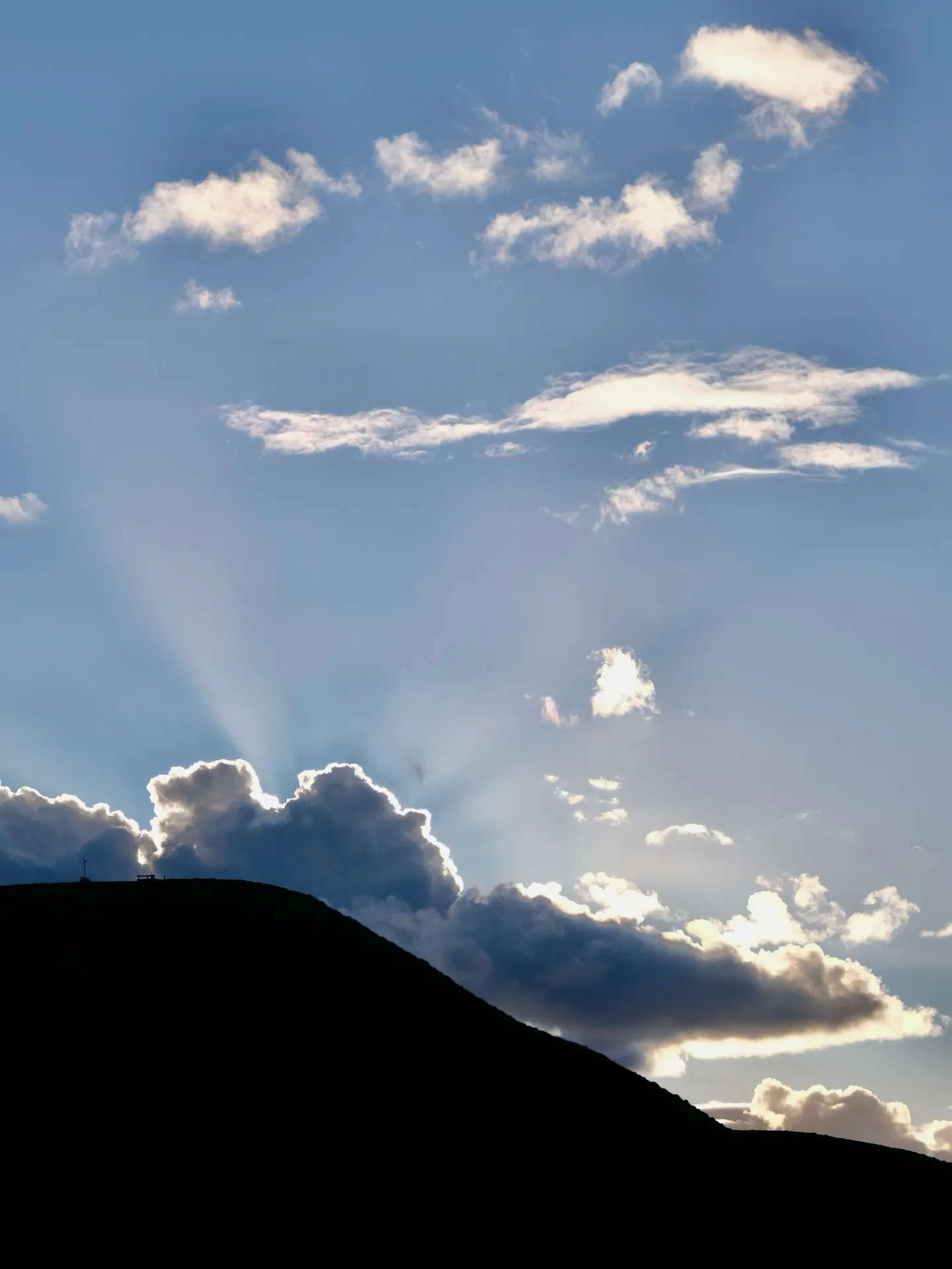 Sunbeams bursting from behind the hill on Great Mercury Island. Sunbeams bursting from behind the hill on Great Mercury Island.