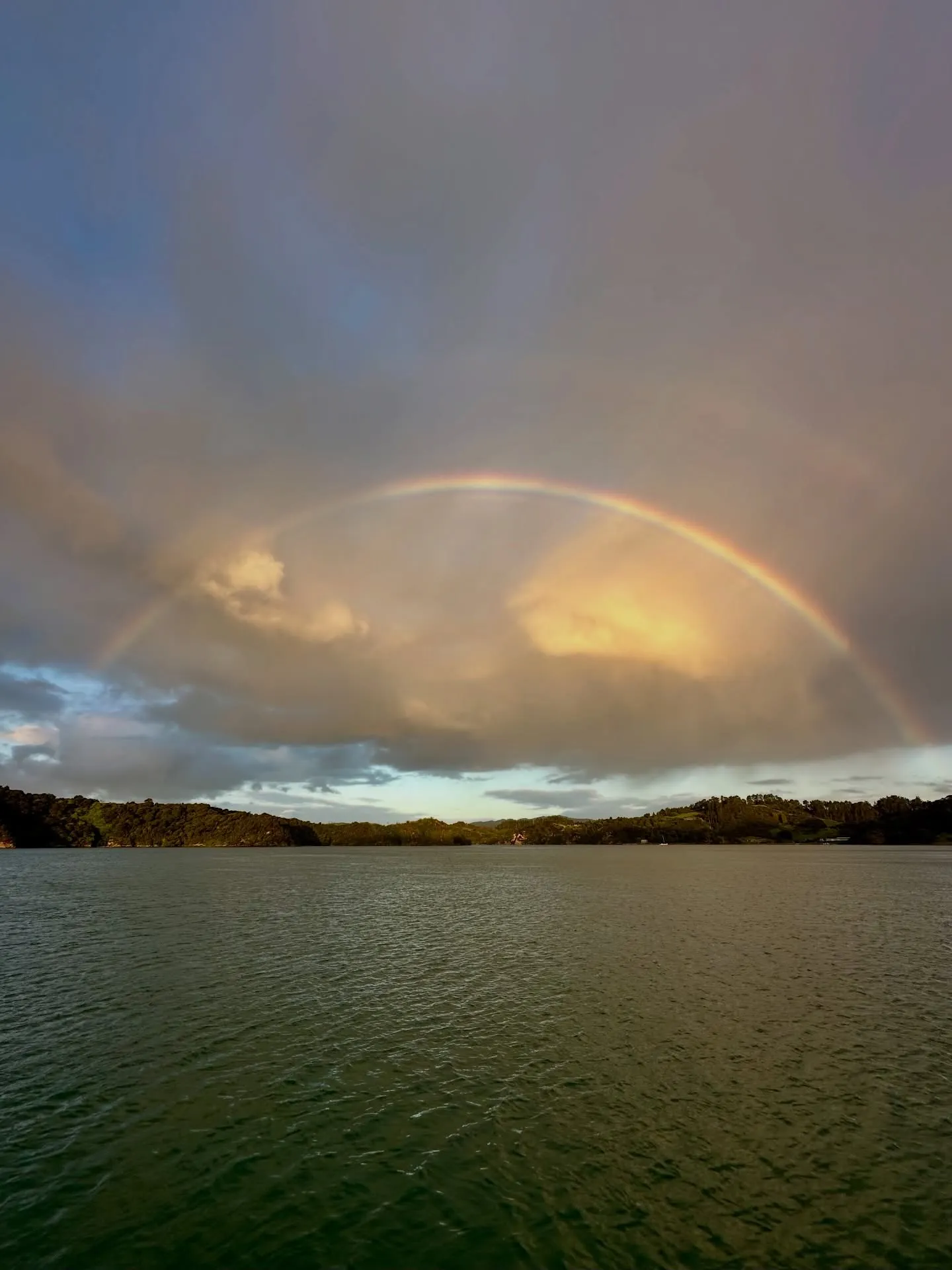 A rainbow arcs over the bay. A rainbow arcs over the bay.