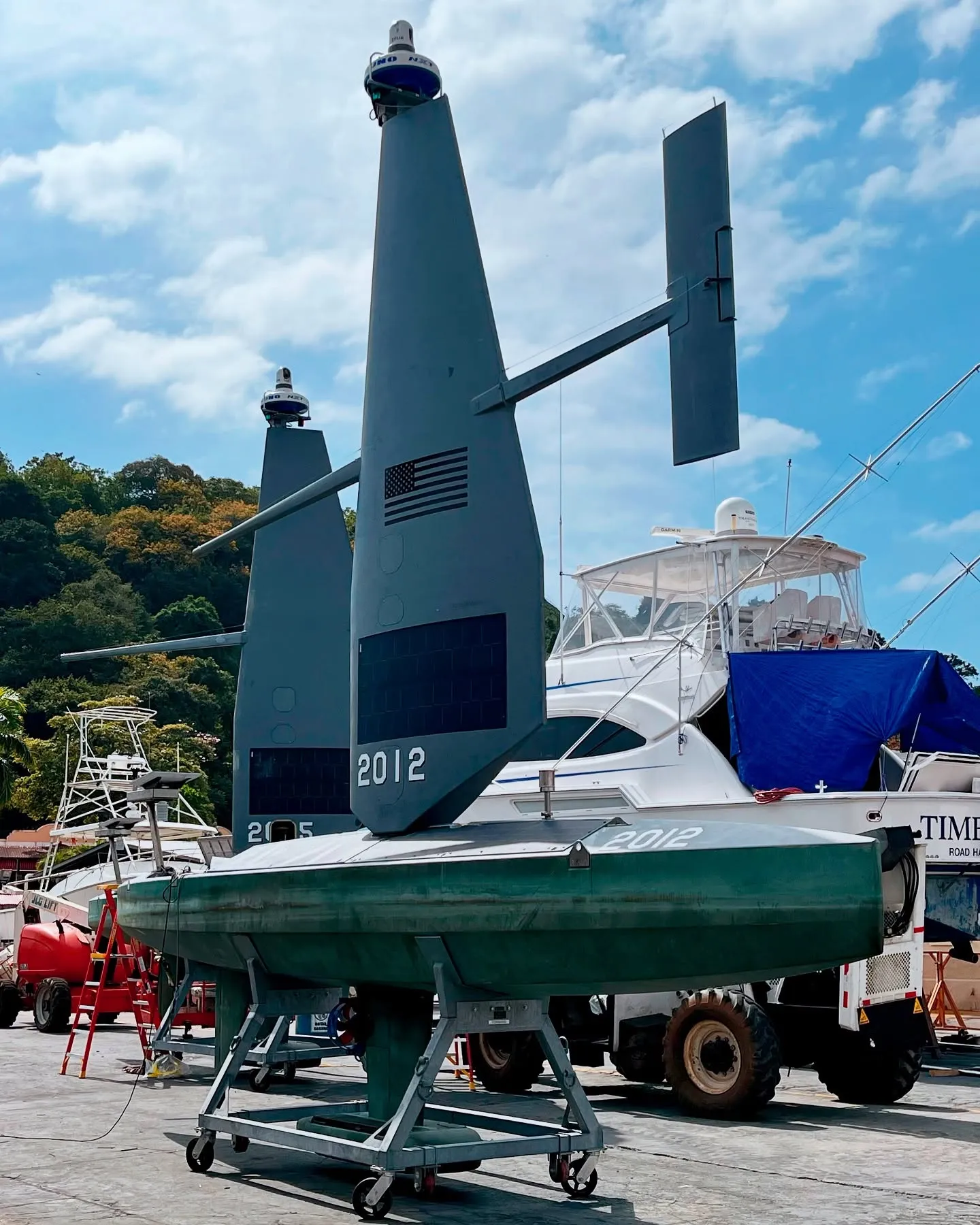 Saildrone units being serviced in the marina. Saildrone units being serviced in the marina.