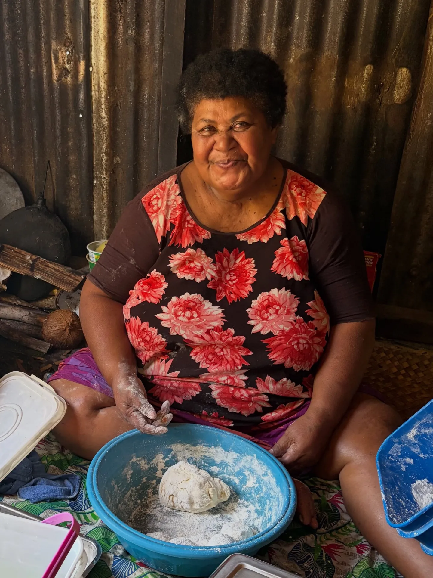 Local lady Sulu kneading dough in a village kitchen. Local lady Sulu kneading dough in a village kitchen.